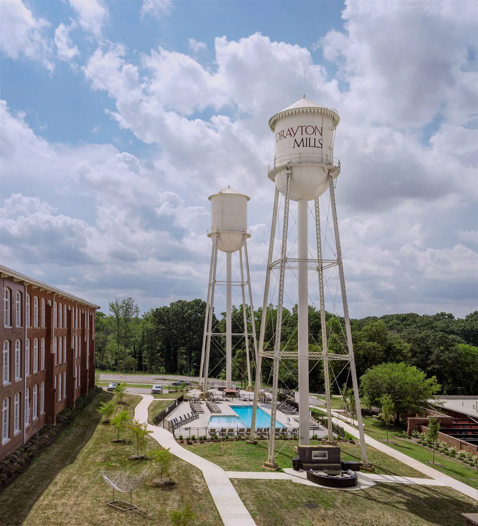 Aerial view of the twin water towers and saltwater pool at Drayton Mills Lofts in Spartanburg, SC