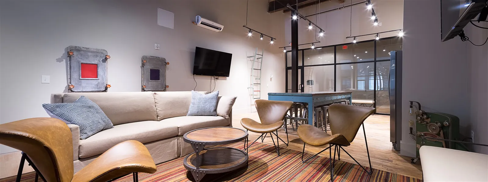 Weaving community room with lounge seating at Drayton Mills Lofts