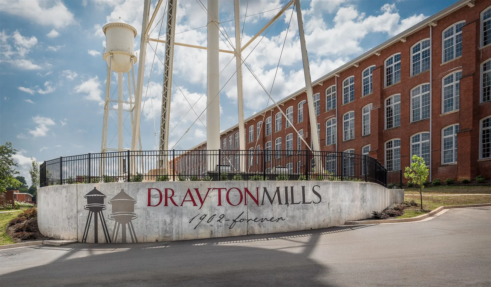 Drayton Mills entrance sign beneath the historic water towers