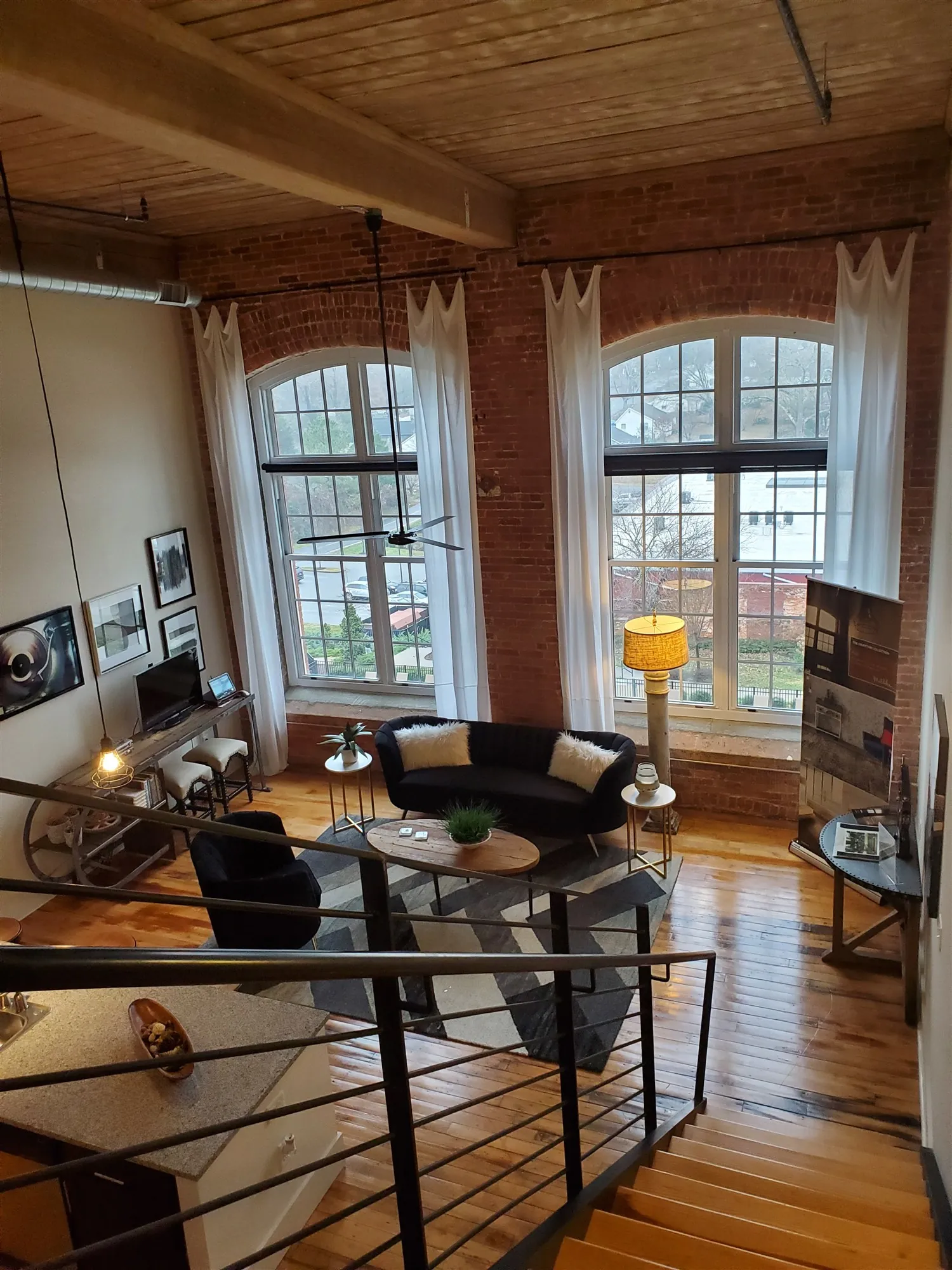 View down from the loft level over the living area of three bedroom loft S325 at Drayton Mills
